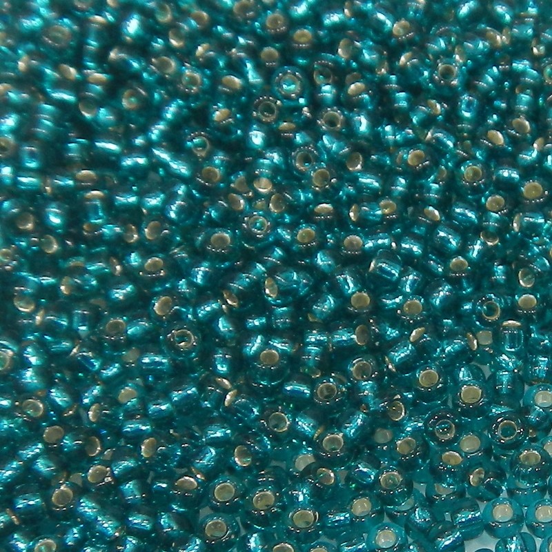 SEED BEAD, MIYUKI, 11/0 SILVERLINED TRANSPARENT DARK TEAL (RR30). SOLD PER PACK OF 10GM.
